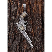carved mexican gun pendant